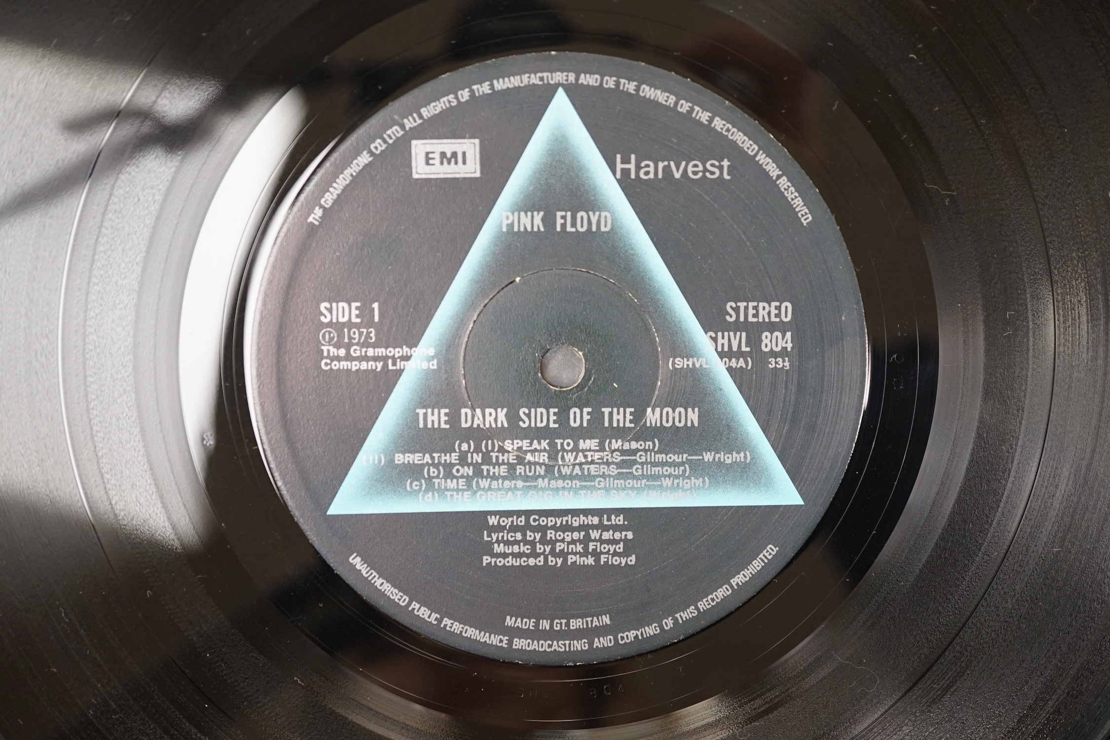 Three Pink Floyd LP record albums; Dark Side of the Moon, on Harvest SHVL 804, with both posters and black inner sleeve, The Wall, on Harvest SHSP 4111 A 2U, Relics, on Starline, SRS 5071